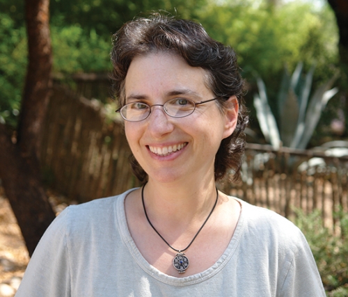 A portrait of Laura Markowitz, the author, smiling. 